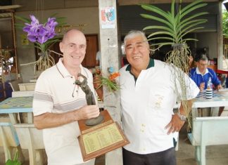 Winner Richard Hall, left, with the monthly trophy, is flanked by runner up Herb Ishinaga.